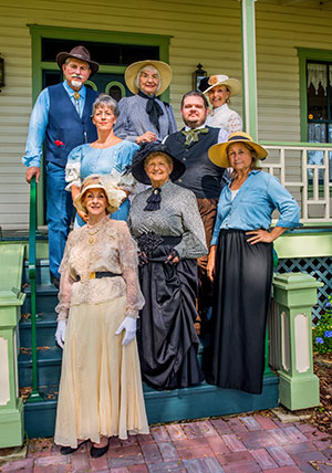 Volunteer docents wear period clothing