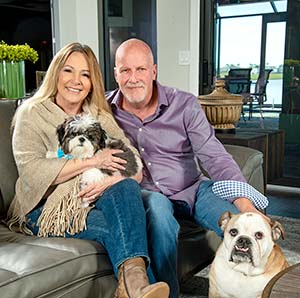 Michelle and Chuck Muller relax with best furry friends, Zoey and Bentley.