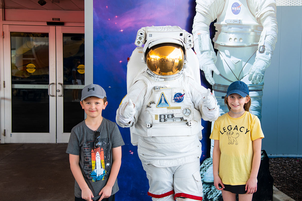 Children pose with an “astronaut” 
