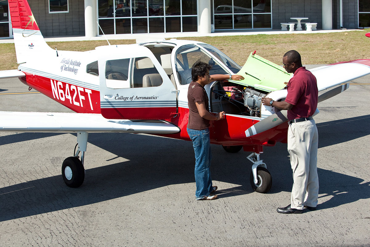 An F.I.T. Aviation student works with an instructor