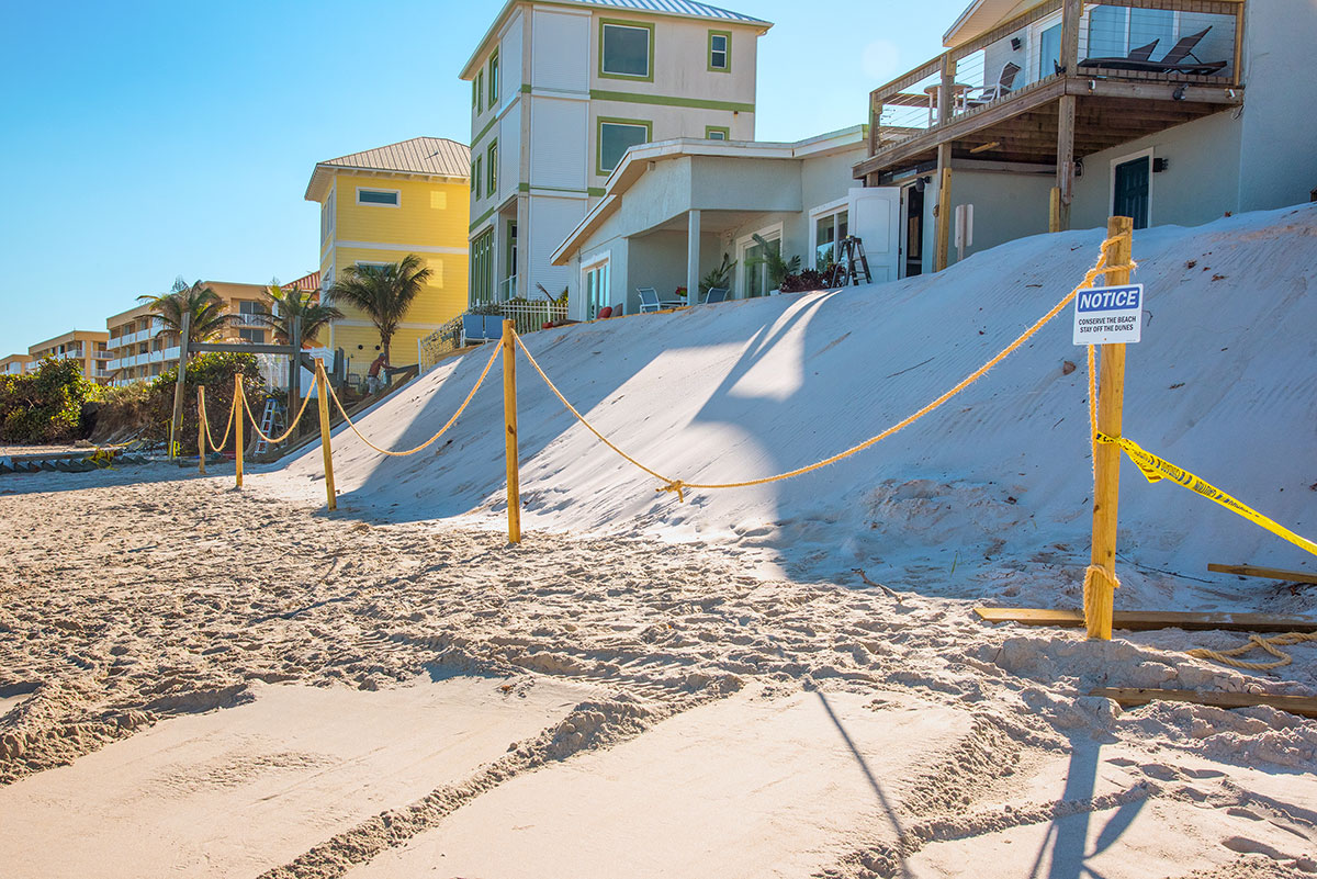 Sand was dumped on the beach to form a private dune in front of a Satellite Beach home following dune erosion from Hurricane Nicole.