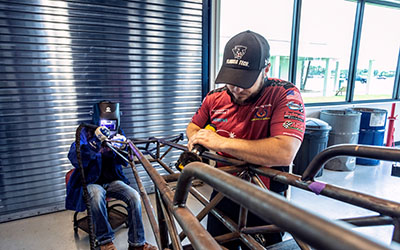 Costello, right, a 2016 graduate of Florida Institute of Technology and a driver for the Florida Tech dragster, is now an engineer at L3Harris. He enjoys working at the LMS shop, where he reaps the benefits of discovering new technologies as a driver and as a mentor for the interns from Florida Tech.