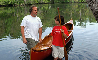 Michael Grace and son setting out by canoe on St. Marks River