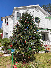 Brightly decorated trees ring Green Gables during the holidays