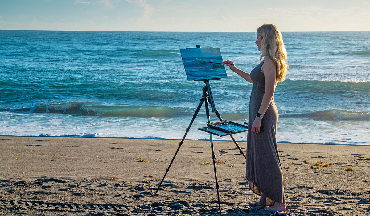 En plein air artist Emily Collins Neel paints at Melbourne Beach.