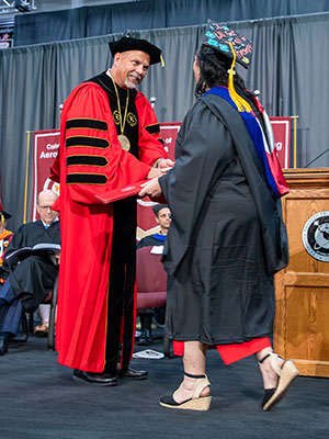 Nicklow congratulates a student during Florida Tech’s commencement exercises.