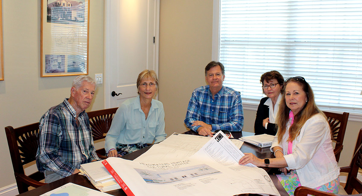 General contractor Robert Banov, architect Amy Banov, Florida Remembered Society secretary/treasurer Greg Nelson, president Anne Sinnott, and board member Brenda Burnette study the plans for the center, with a groundbreaking expected later this year.