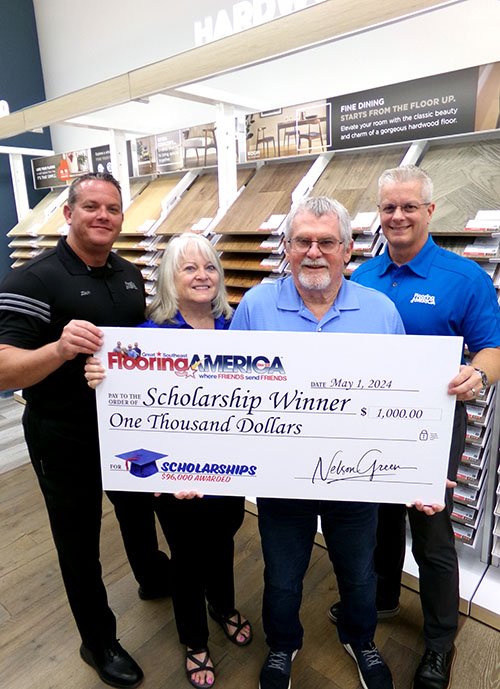 Flooring America employees with large scholarship check