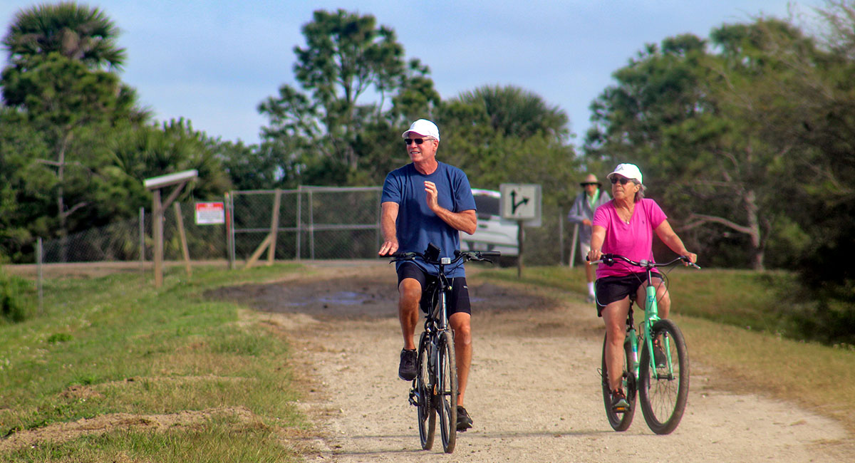 Bicycling around the berms is a great way to enjoy nature at the wetlands.